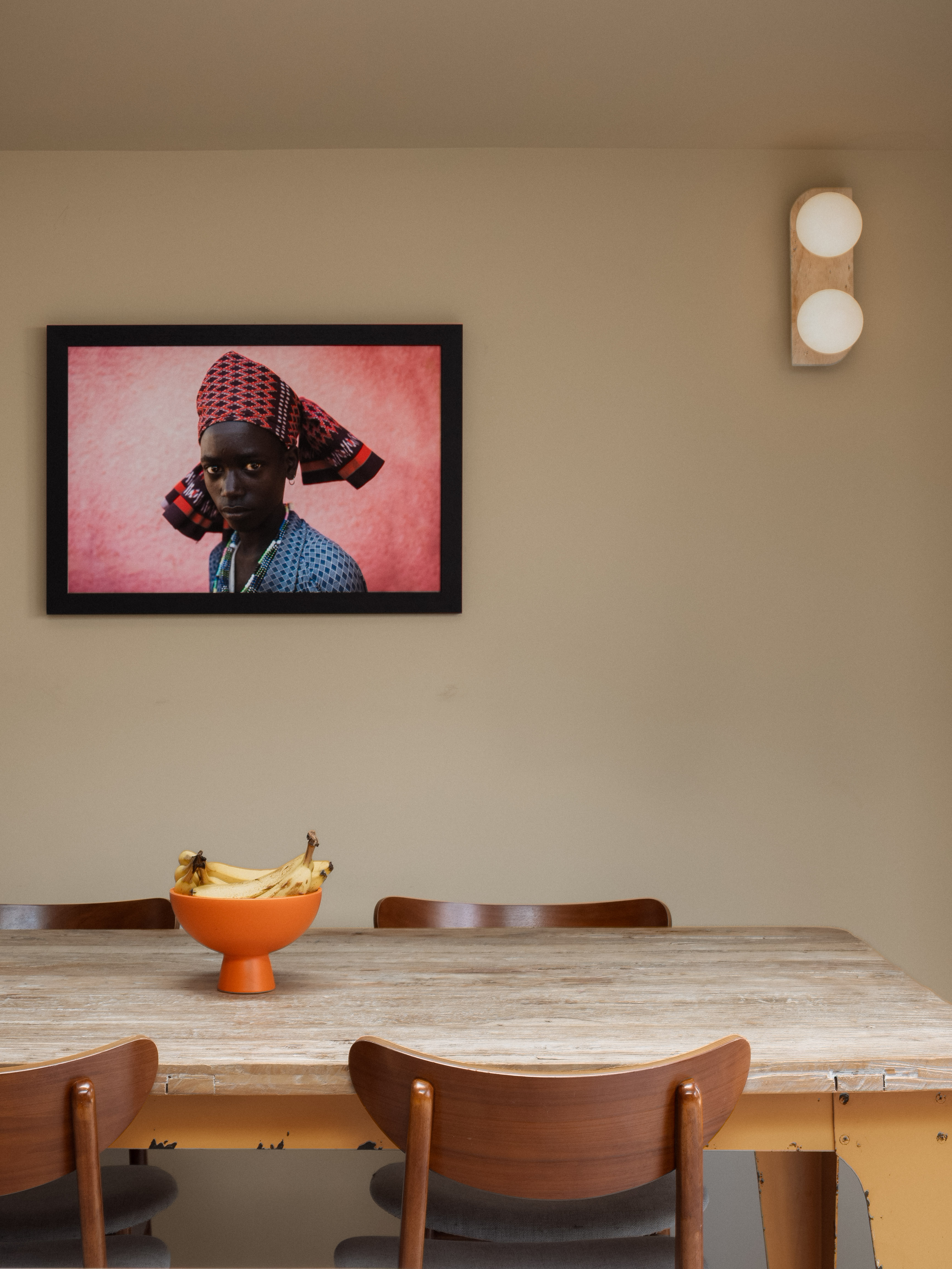Dining area with artwork and orange bowl at Ewhurst Road