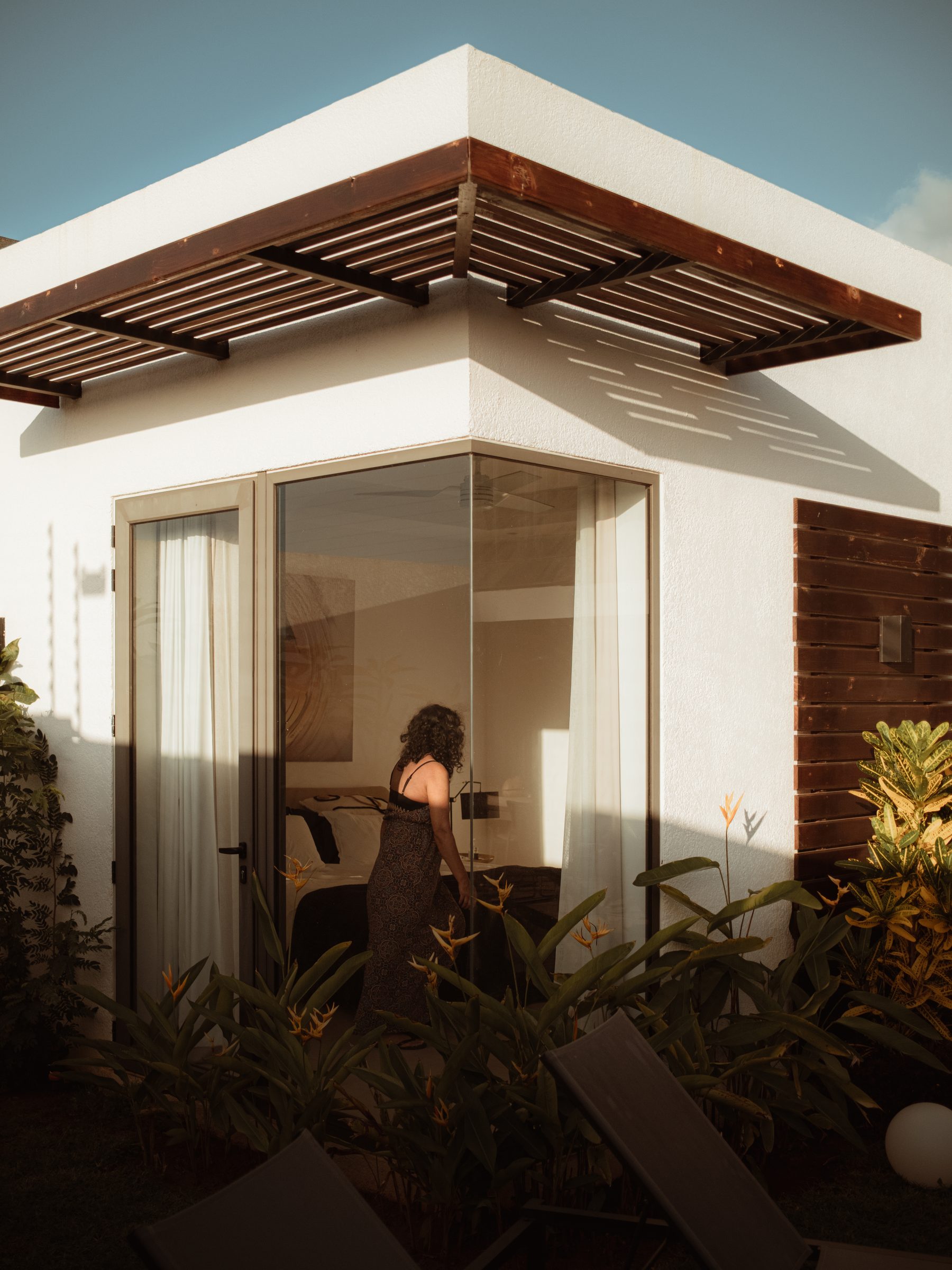 Figure at the window beneath the pergola