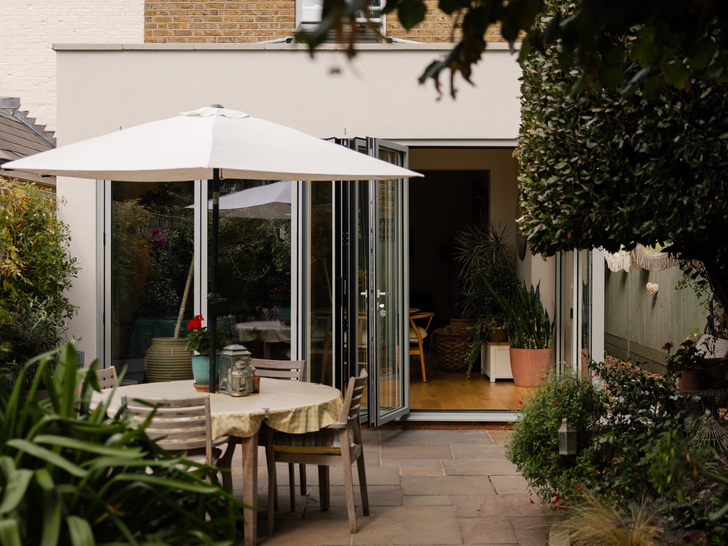 Garden terrace looking back to the open glass doors